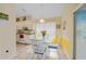 Kitchen breakfast nook with glass table and white chairs at 215 Australian Dr, Rotonda West, FL 33947