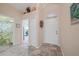 Bright entryway with tile flooring, access to bathroom and additional room at 215 Australian Dr, Rotonda West, FL 33947