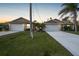 Front view of two-unit home with attached garages at 215 Australian Dr, Rotonda West, FL 33947