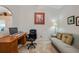 Home office with desk, chair, and comfortable sofa at 215 Australian Dr, Rotonda West, FL 33947