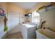 Laundry room with washer, dryer, and utility sink at 215 Australian Dr, Rotonda West, FL 33947