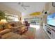 Spacious living room with comfortable seating and large TV at 215 Australian Dr, Rotonda West, FL 33947