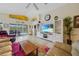 Living room features pool view and built-in entertainment center at 215 Australian Dr, Rotonda West, FL 33947