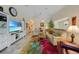 Bright and airy living room with comfortable seating and large screen TV at 215 Australian Dr, Rotonda West, FL 33947