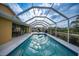 Inviting swimming pool with a screened enclosure at 215 Australian Dr, Rotonda West, FL 33947