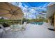 Screened pool and patio with outdoor furniture at 215 Australian Dr, Rotonda West, FL 33947