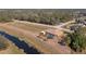 Aerial view of home with pool and canal-side location at 2194 Wenona Dr, North Port, FL 34288