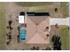 Directly above view of house, pool, and landscaping at 2194 Wenona Dr, North Port, FL 34288