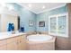 Bathroom with a large soaking tub and double vanity at 2194 Wenona Dr, North Port, FL 34288