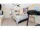 Bright bedroom with a treadmill and ensuite bathroom access at 2194 Wenona Dr, North Port, FL 34288
