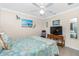 Bedroom with coastal decor and ceiling fan at 2194 Wenona Dr, North Port, FL 34288
