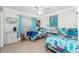 Bedroom with two twin beds, and ocean decor at 2194 Wenona Dr, North Port, FL 34288