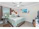 Bedroom with coastal decor and ceiling fan at 2194 Wenona Dr, North Port, FL 34288