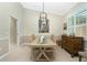 Bright dining room featuring a wood table, decorative runner, and a vintage buffet at 2194 Wenona Dr, North Port, FL 34288