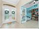 Entryway with view of dining room and den with French doors at 2194 Wenona Dr, North Port, FL 34288