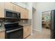 Updated kitchen with stainless steel appliances and granite at 2194 Wenona Dr, North Port, FL 34288