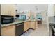 Spacious kitchen with granite countertops and island at 2194 Wenona Dr, North Port, FL 34288