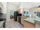 Open kitchen boasts granite counters & stainless steel appliances at 2194 Wenona Dr, North Port, FL 34288
