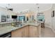 Well-equipped kitchen with granite counters and breakfast bar at 2194 Wenona Dr, North Port, FL 34288