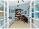 Multi-purpose room with built-in shelving, a desk, and a comfortable bed at 2194 Wenona Dr, North Port, FL 34288
