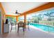 Inviting pool area with patio furniture and screened enclosure at 2194 Wenona Dr, North Port, FL 34288