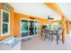 Covered patio with table and chairs overlooking the pool at 2194 Wenona Dr, North Port, FL 34288