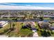 Bird's-eye view of single-story home on a canal at 241 Marker Rd, Rotonda West, FL 33947