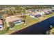 Aerial view of home with pool and canal access at 241 Marker Rd, Rotonda West, FL 33947