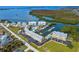 Bird's-eye view of waterfront community, showing condos, marina, and boat at 2424 Placida Rd # C101, Englewood, FL 34224