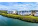 Aerial view of waterfront property, showing building and landscaping at 2424 Placida Rd # C101, Englewood, FL 34224