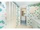 Tropical-themed bathroom with double vanity and storage at 2424 Placida Rd # C101, Englewood, FL 34224