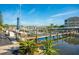 Community boat docks with a wooden walkway at 2424 Placida Rd # C101, Englewood, FL 34224
