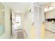 Bright and airy entryway with storage and kitchen view at 2424 Placida Rd # C101, Englewood, FL 34224