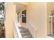 Condo entrance with stairs and white railing at 2424 Placida Rd # C101, Englewood, FL 34224