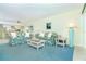 Living Room with floral couches and wicker coffee table at 2424 Placida Rd # C101, Englewood, FL 34224