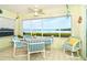 Enjoy waterfront views from this sunroom dining area at 2424 Placida Rd # C101, Englewood, FL 34224
