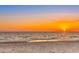 Beach at sunset with clear skies and ocean waves, creating a serene and picturesque waterfront scene at 2450 N Beach Rd # 113, Englewood, FL 34223