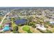 Aerial view of community including golf course and waterfront homes at 252 Medalist Rd, Rotonda West, FL 33947