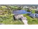 Property features a lake view and lush landscaping at 252 Medalist Rd, Rotonda West, FL 33947