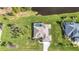 Property's top-down view highlighting the house, pool, and landscaping at 252 Medalist Rd, Rotonda West, FL 33947