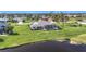 Stunning property with a large backyard, pool and lake view at 252 Medalist Rd, Rotonda West, FL 33947