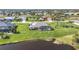 Aerial view showing home with pool, large backyard, and canal access at 252 Medalist Rd, Rotonda West, FL 33947