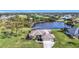 Luxury property with a large backyard, pool and lake view at 252 Medalist Rd, Rotonda West, FL 33947