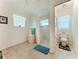Main bathroom with walk-in shower, separate toilet, and tile flooring at 252 Medalist Rd, Rotonda West, FL 33947