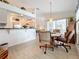 Bright dining area with kitchen and Gathering room access at 252 Medalist Rd, Rotonda West, FL 33947