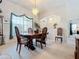 Dining room with wood table and chairs, and view to other rooms at 252 Medalist Rd, Rotonda West, FL 33947