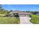Beautiful home with two-car garage and manicured lawn at 252 Medalist Rd, Rotonda West, FL 33947