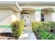 Inviting front entrance with double doors and lush landscaping at 252 Medalist Rd, Rotonda West, FL 33947