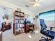 Bright home office features built-in shelving and a view into the living room at 252 Medalist Rd, Rotonda West, FL 33947