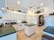 Spacious kitchen with island, lots of cabinets, and view of dining area at 252 Medalist Rd, Rotonda West, FL 33947